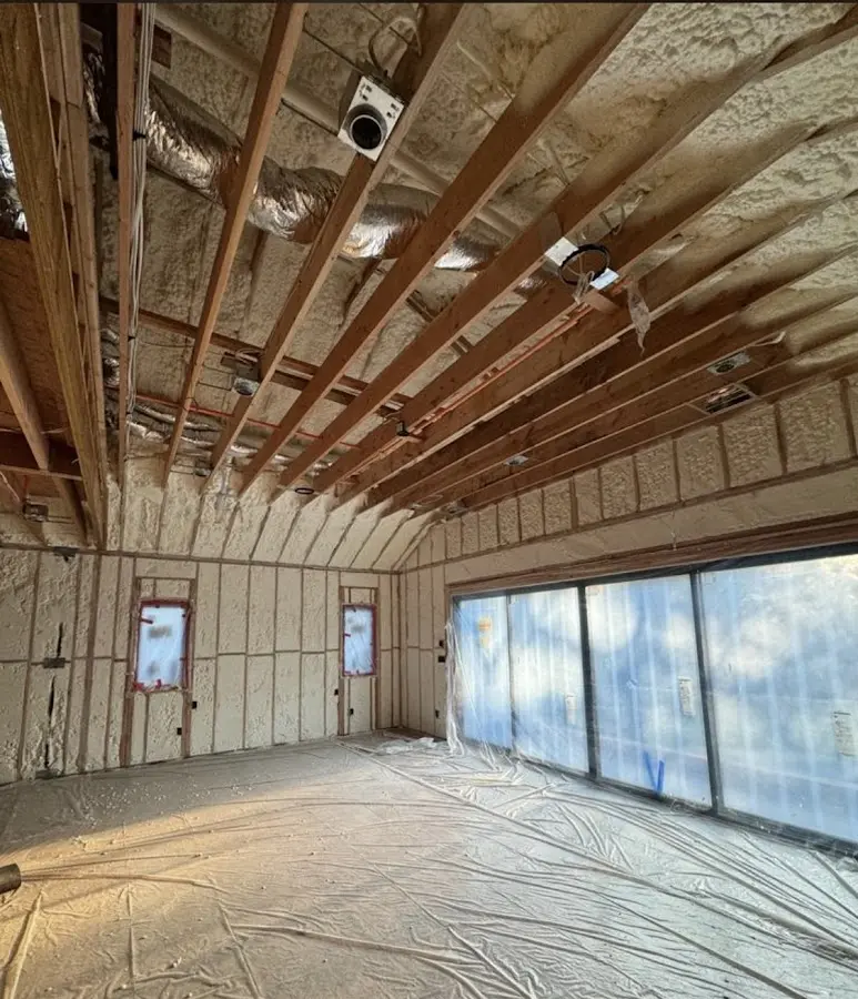 Interior walls and ceiling insulated with spray foam during new construction in Norridge